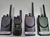 Motorola transceivers. |  I expect those devices are software-programmed. That looks like a plug that is...
