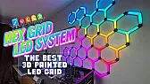 Printed hexagon wall of light behind a desk |  When it is running, this wall-mounted hexagon grid sits behind the maker's...